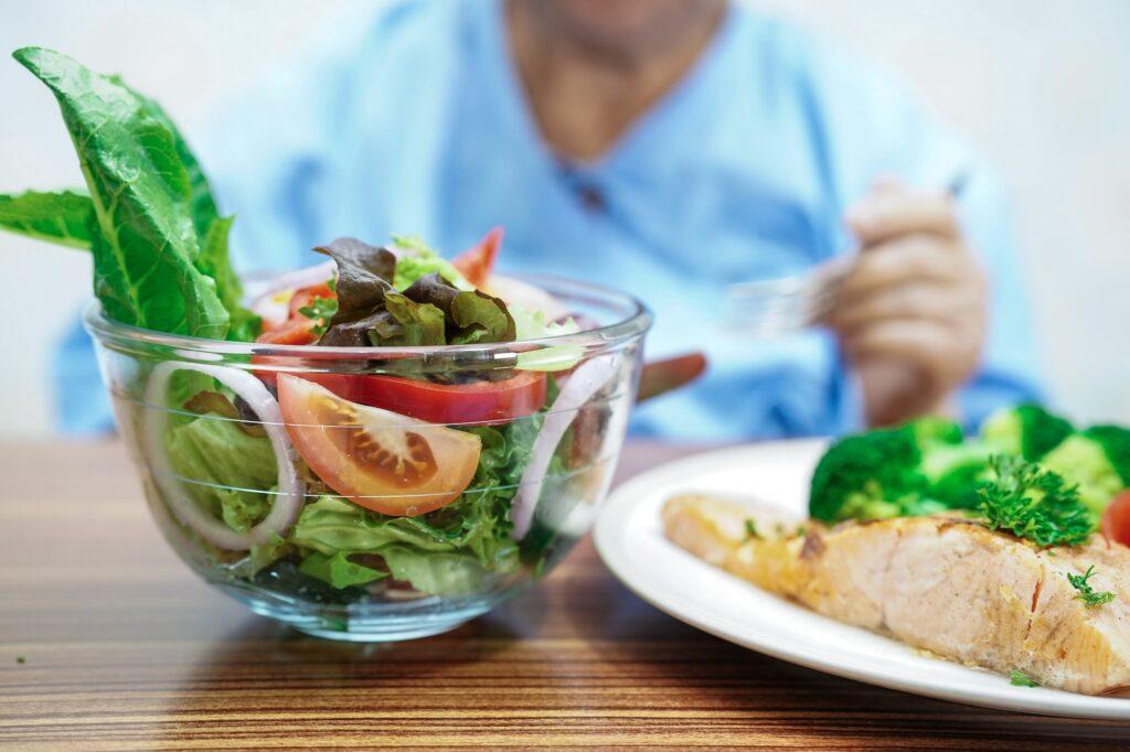 Asian elderly woman patient eating breakfast healthy food