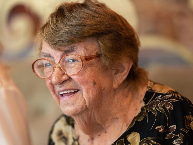 happy-elderly-woman-at-family-dinner-2022-02-09-15-46-48-utc happy elderly woman